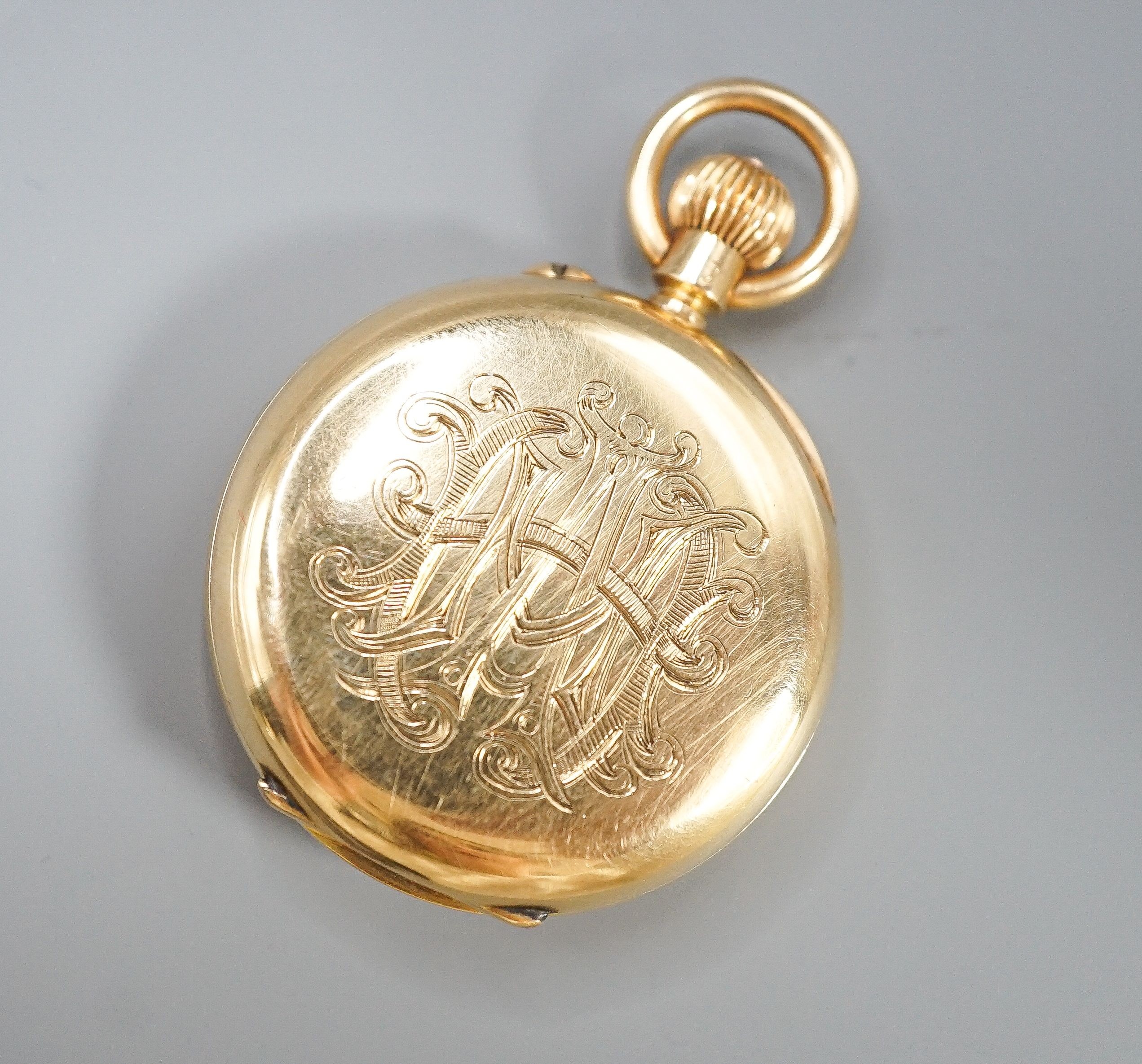 An Edwardian 18ct gold and guilloche enamel half hunter fob pocket watch, case diameter 35mm, gross 47.3 grams.